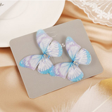 barrette en forme de papillon bleu