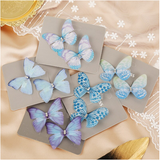 barrettes papillons bleus