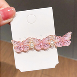 pince plate pour cheveux avec papillon rose