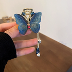 barrette en forme de papillon bleu pendant luxe