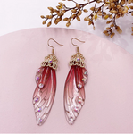 boucles d oreilles pendantes papillon or