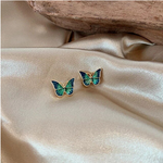 boucles d oreilles avec papillon bleu