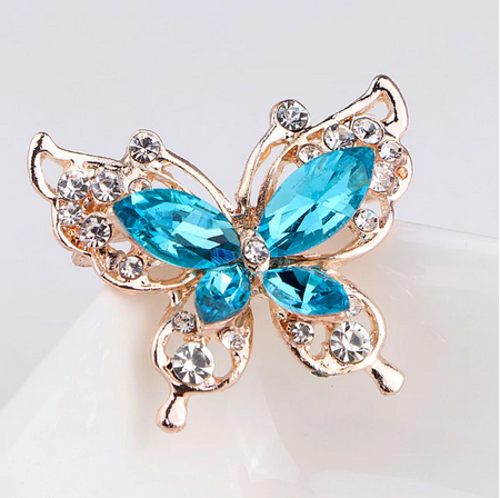 broche en forme de papillon bleu turquoise