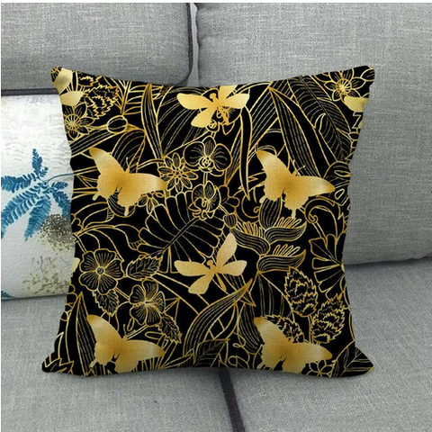 coussin papillon noir et or