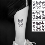 tatouage papillon en noir et blanc