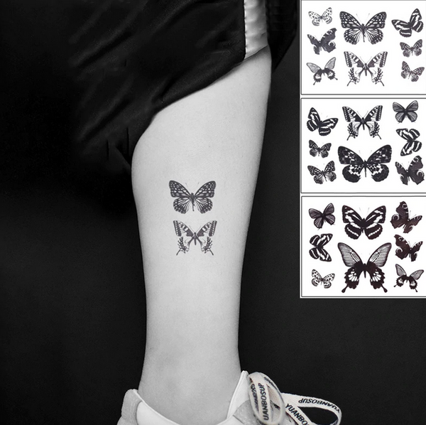 petit tatouage de papillon noir et blanc